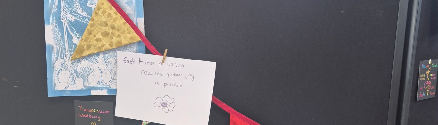 pictures and messages of hope against a black pinbiard with coloured bunting
